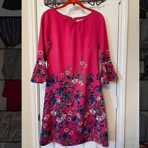 Knee length dress with bright colors and lots of details.